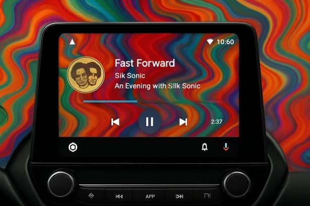 Android Auto music player with album art background on the car dashboard screen