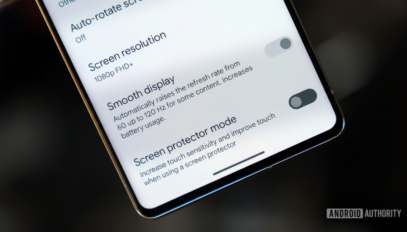 A close -up shot of a smartphone screen displaying various settings options, including Screen resolution, Smooth display, and Screen protector mode.
