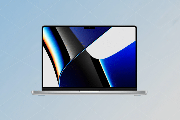 A silver laptop with a vibrant blue and black abstract wallpaper on the screen, set against a light blue background with a subtle geometric pattern.