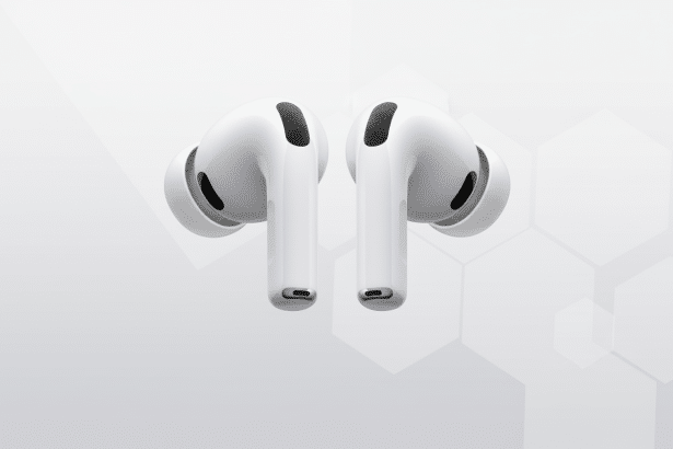 A pair of white AirPods Pro earbuds with black speaker grilles, presented against a professional light grey background with subtle hexagonal patterns.