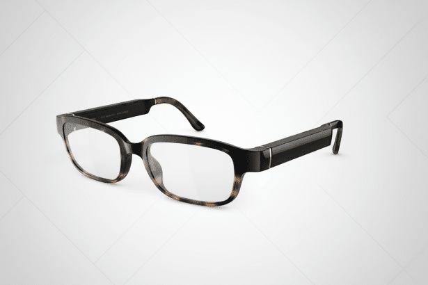 A pair of smart glasses with tortoise - shell frames and thick black temples, presented at a slight angle on a subtle gray patterned background.