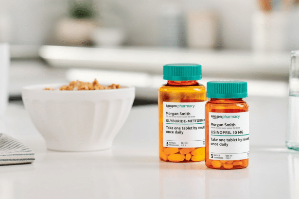 Two prescription bottles from Amazon Pharmacy, labeled for Morgan Smith, with Glyburide- Metformin and Lis inopril 10 mg, sitting on a kitchen counter next to a bowl of cereal and a glass of water.