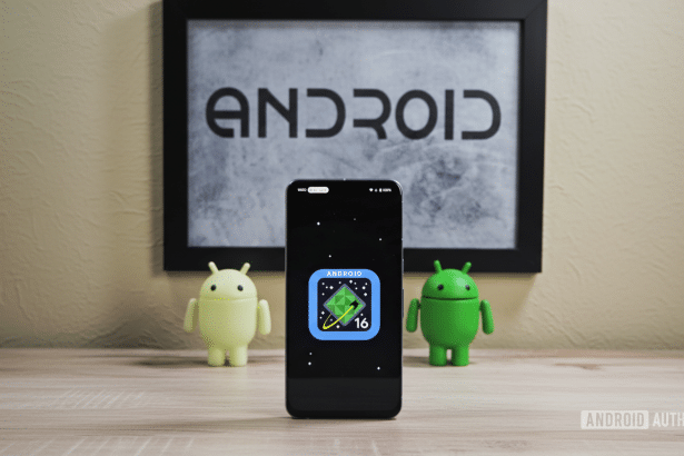 A smartphone displaying the Android 1 6 logo, flanked by two Android figurines , with an Android framed picture in the background.