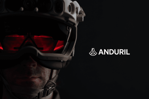 A close-up of a person wearing a futuristic white helmet with glowing red goggles, with the Anduril logo on a dark background.