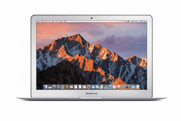 A professional shot of a MacBook Air laptop with a mountain range sunset desktop background, resized to a 1 6:9 aspect ratio.