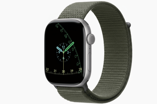 An Apple Watch with a grey case and a green fabric band, displaying a watch face with a blue and green clock and a date complication.