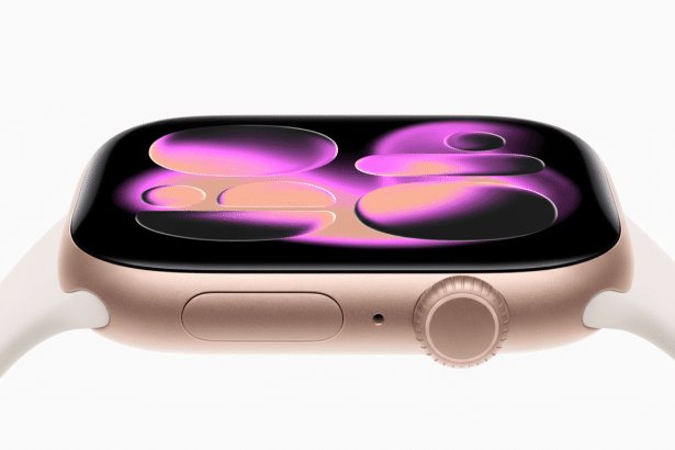 A gold Apple Watch with a white band, displaying a colorful, abstract watch face, on a pure white background.