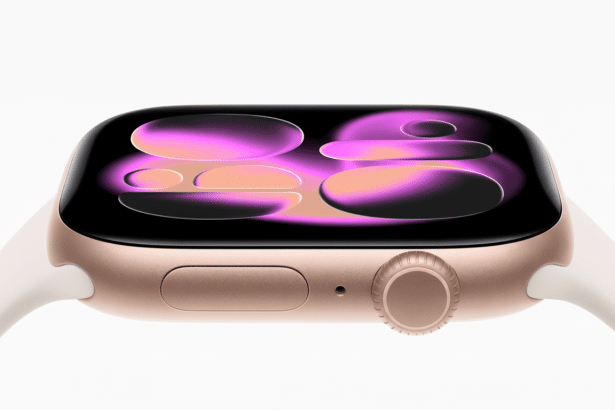 A close-up, professional shot of a rose gold Apple Watch with a white band, displaying a vibrant pink and purple abstract watch face, set against a cl