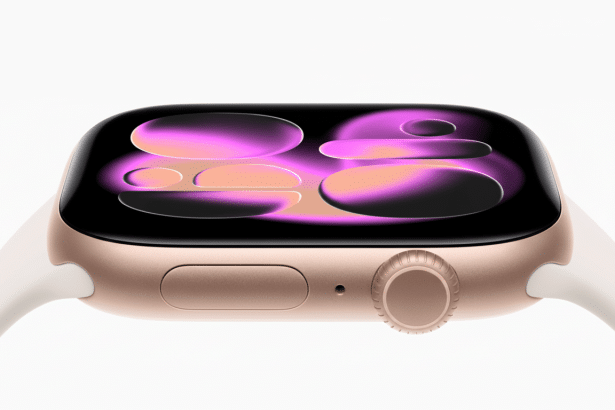 A close -up, high -angle view of a gold- colored Apple Watch with a white band, displaying a vibrant, abstract purple and orange watch face against a