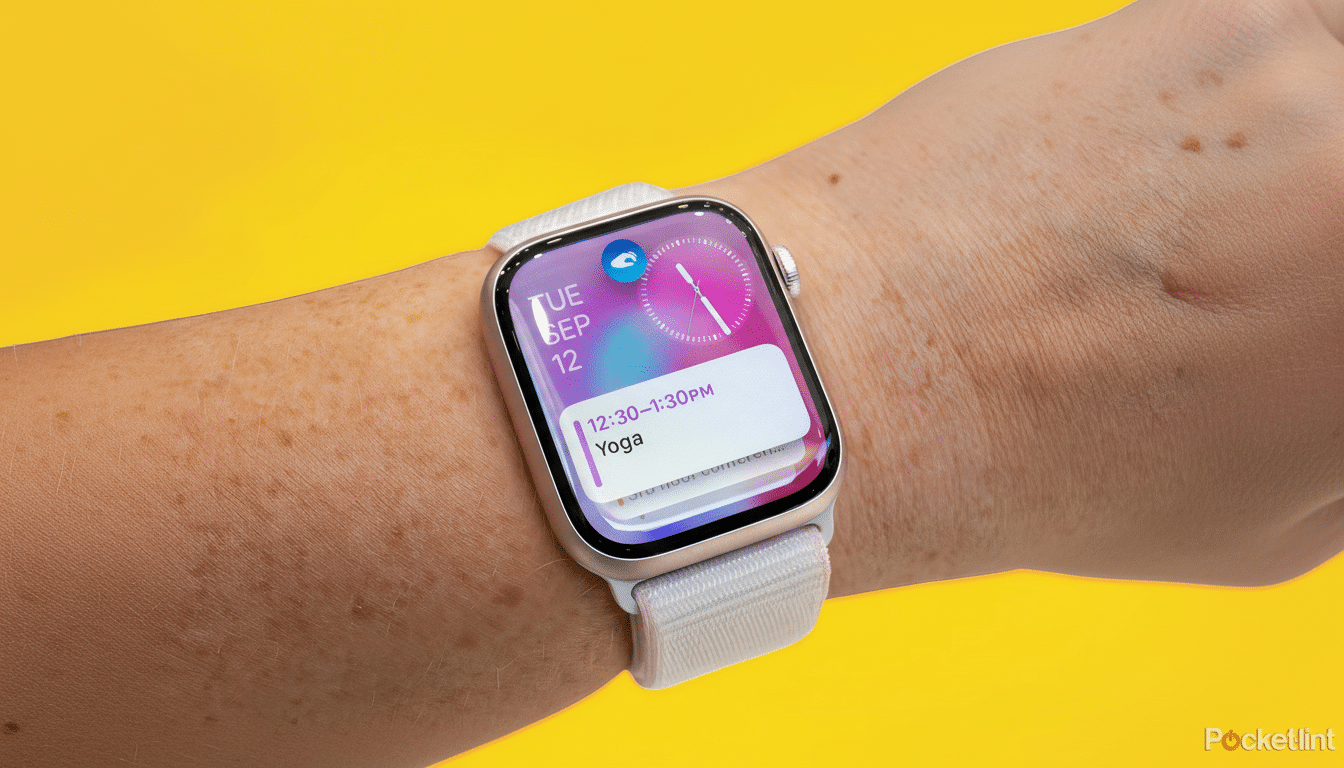An Apple Watch on a person s wrist, displaying a calendar notification for Yoga from 12: 30-1: 30 PM on Tuesday, September 1 2th, against a vibrant ye