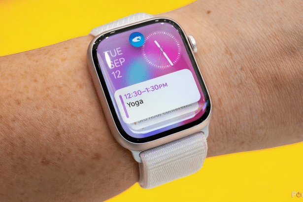 An Apple Watch on a person s wrist, displaying a calendar notification for Yoga from 12: 30-1: 30 PM. The watch face shows the date as T UE SEP 1 2 an