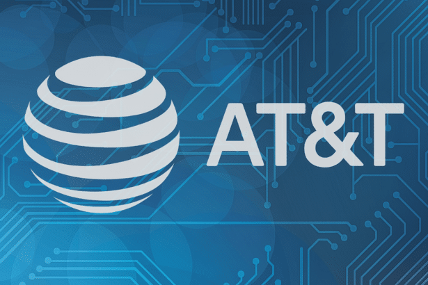 AT&T logo against a blue background with circuit board patterns .