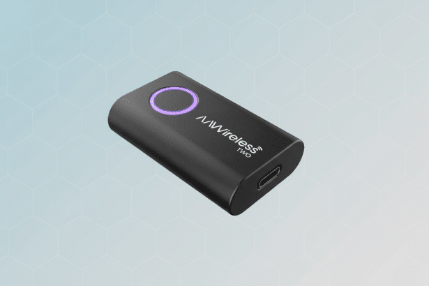 Wireless TWO device with a purple illuminated button. Filename: av wirelesstwo device.png