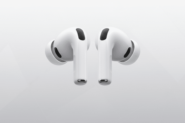 alt text: Two white earbuds , likely AirPods Pro, shown from a slightly angled front view against