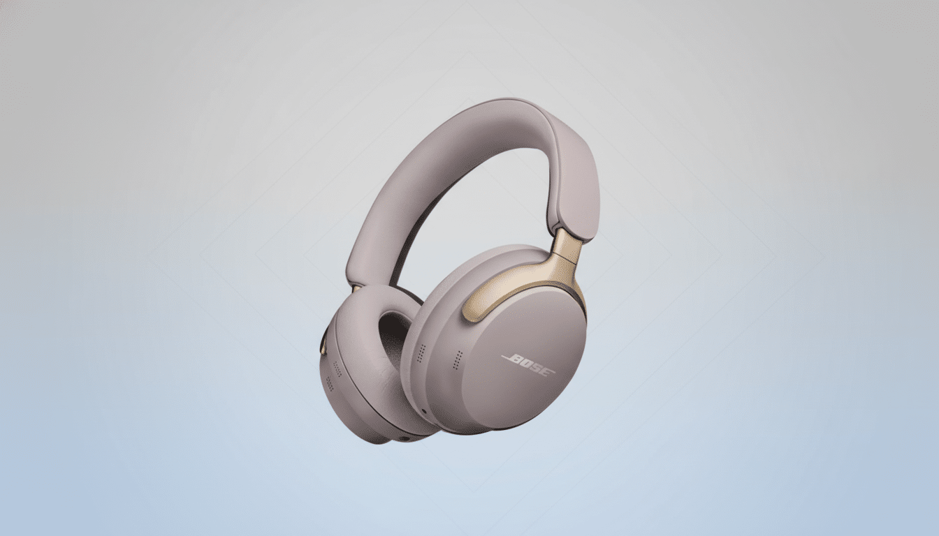A pair of light gray and gold Bose noise -canceling headphones floating against a professional light gray gradient background with a subtle diamond pa