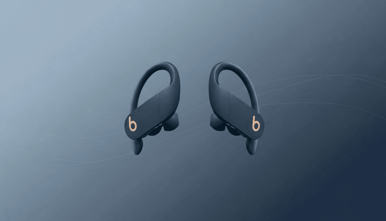 A pair of dark blue Beats Powerbeats Pro wireless earbuds with a copper ' b' logo, presented on a subtle grey- blue gradient background with soft , light grey wave patterns .