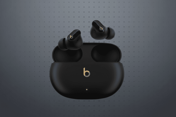 Black Beats Studio Buds with their charging case on a professional grey background with subtle dot patterns. Filename : beatsstudio budsprofessional .png