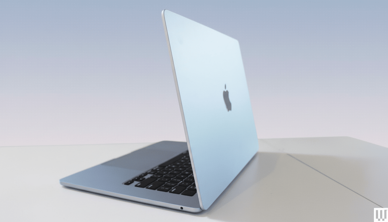 A professional shot of a light blue laptop with a black keyboard, displaying the Apple logo on its screen.