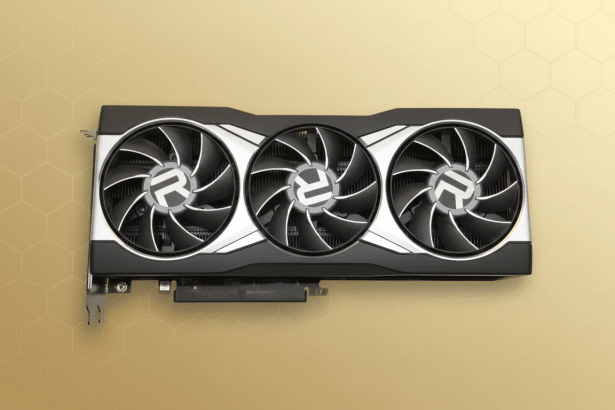 A professional shot of a black and silver graphics card with three fans, set against a subtle golden hexagonal pattern background.