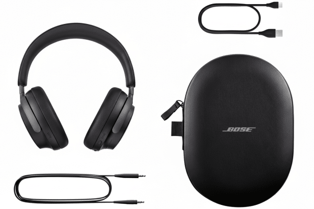 A professional flat lay of black Bose headphones, a carrying case with the Bose logo, a USB-C charging cable, and an audio cable with 3.5mm jacks.