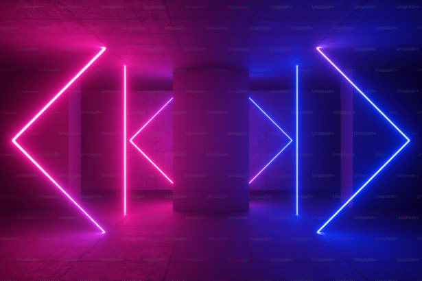 An abstract image featuring pink and blue neon lights forming geometric shapes against a dark, textured background .