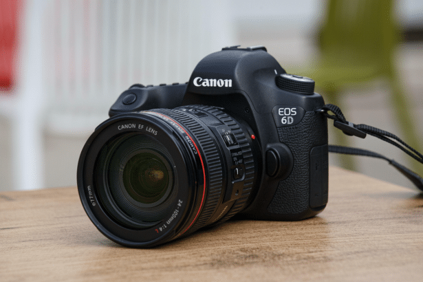 A professional shot of a Canon EOS 6D DSLR camera with an EF 24-1 05mm f /4 L lens, sitting on a wooden surface.
