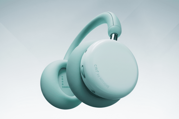 A professional shot of a pair of CMF by Nothing headphones in a light teal color , presented against a clean light grey background with subtle gradient enhancements .