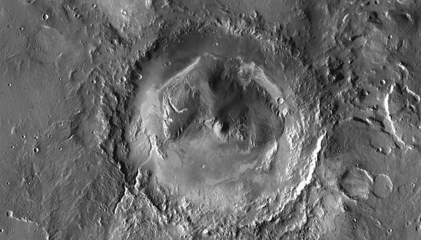 An aerial view of a large, circular impact crater on Mars, showing intricate geological formations and varying shades of gray and white .