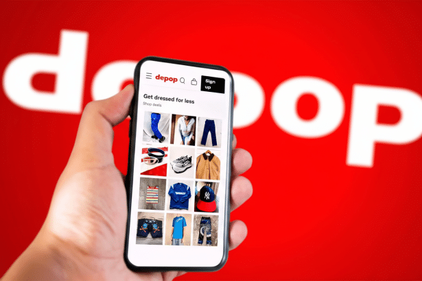A hand holding a smartphone displaying the Depop app on a red background with the white depop logo .
