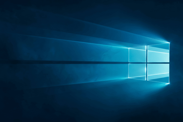 alt = A professional 16:9 aspect ratio image of the Windows logo, depicted as a glowing blue light