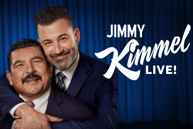 A promotional image for Jimmy Kimmel Live! featuring Jimmy Kimmel embracing Guillermo Rodriguez , with a blue curtain background and the show' s logo.