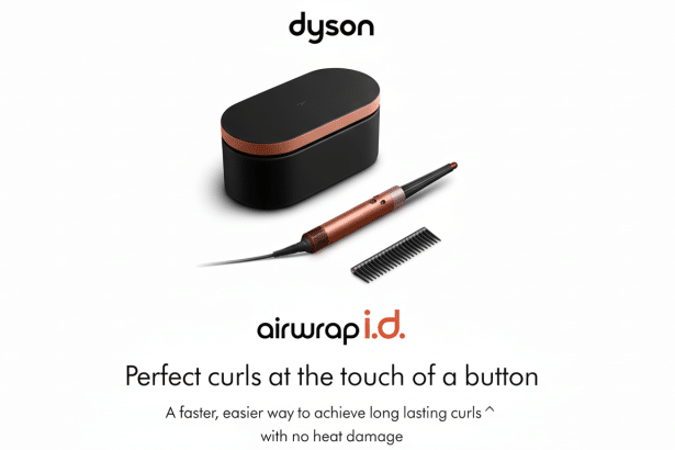 Dyson Air wrap i.d . styling kit with a black and rose gold case , styling wand , and comb, set against a white background with text.
