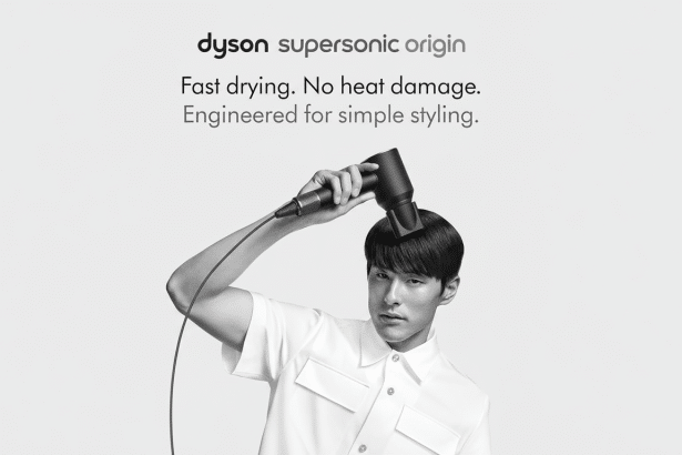 A man drying his hair with a Dyson Supersonic Origin hairdryer. The image is in black and white and includes text promoting the product's features : Fast drying. No heat damage. Engineered for simple styling .