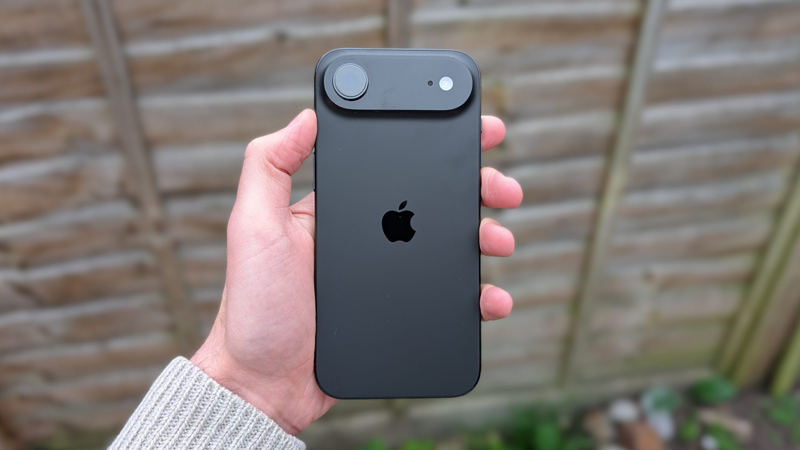 Apple iPhone Air render with assembly line backdrop, highlighting production cuts