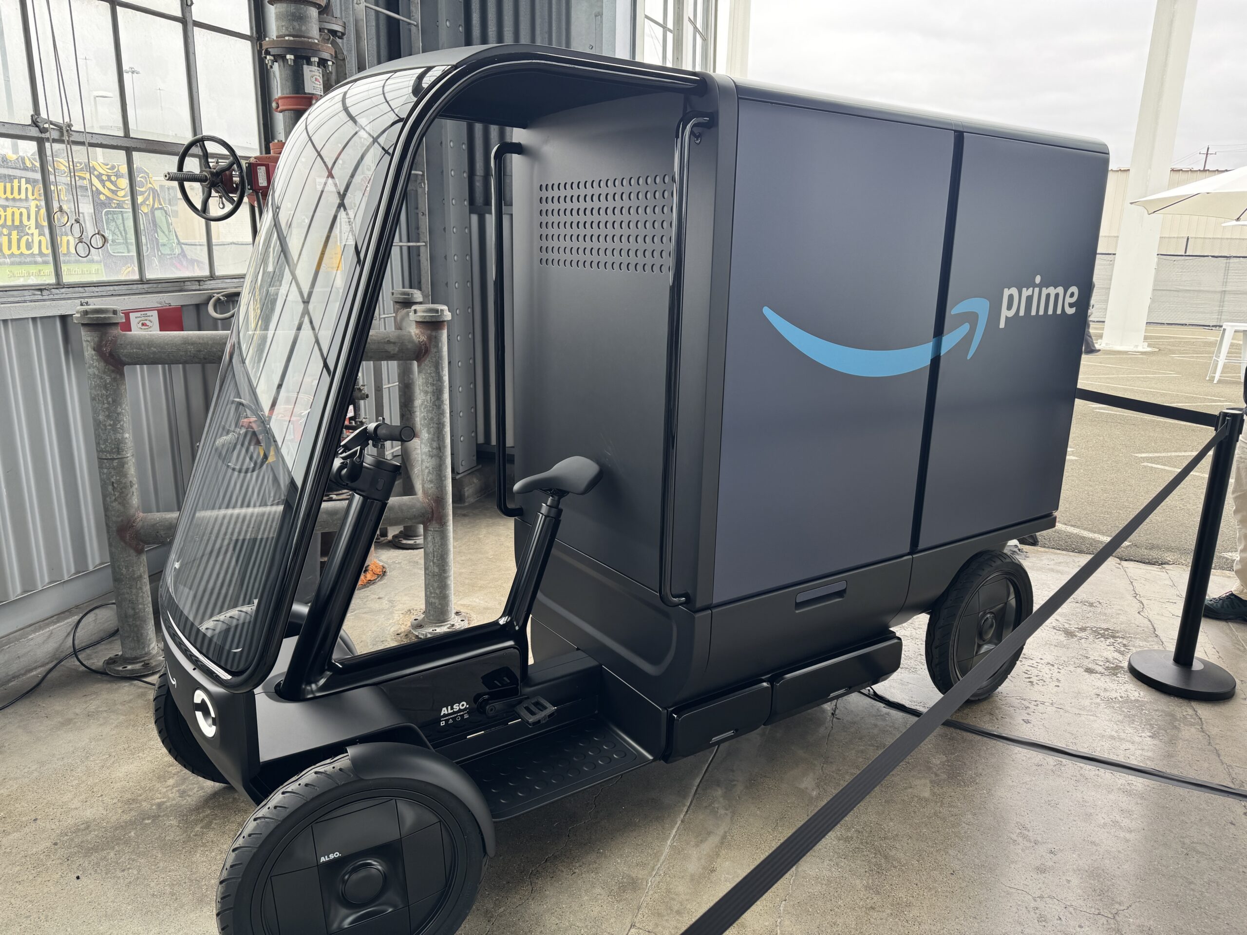Cargo quad e-bike transporting parcels for urban last-mile delivery on city streets