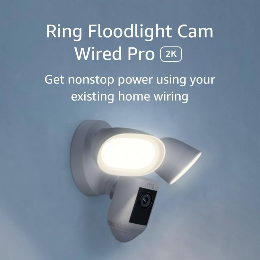 Floodlight Cam Pro security camera with dual floodlights mounted on a home exterior wall