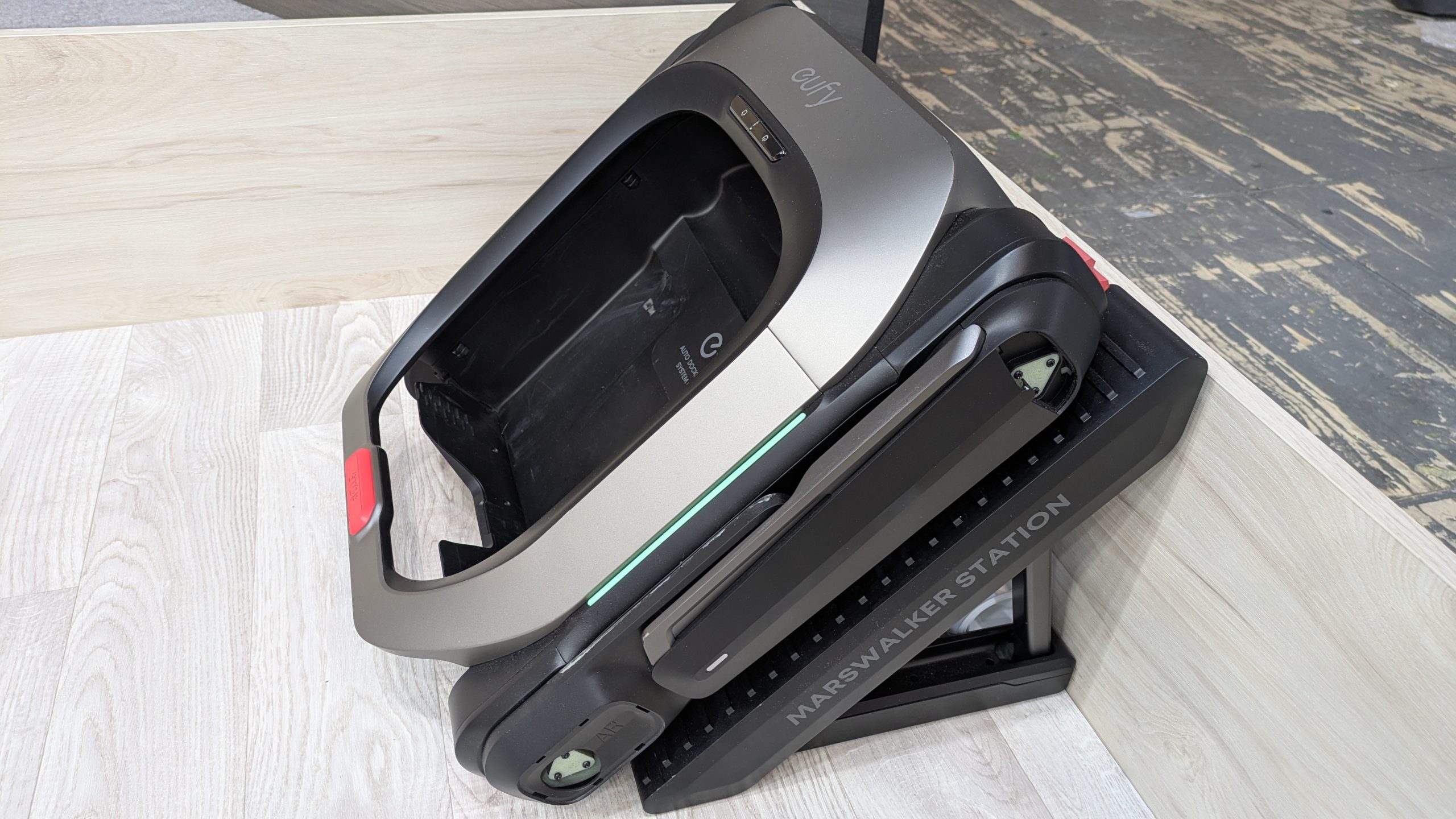 Robot vacuum on a landing near stairs in a multi-level home