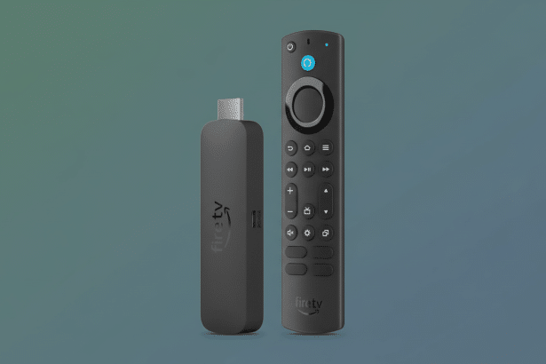 A professional image of an Amazon Fire TV Stick 4K Max and its accompanying voice remote, both in black, presented on a gradient background. The remot