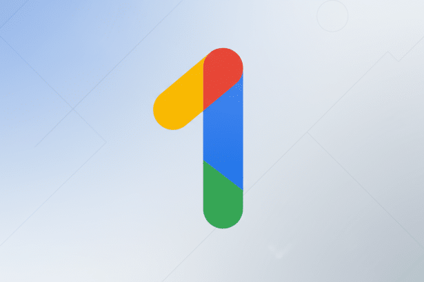 The Google One logo, a stylized number 1 in red, yellow, blue, and green, centered on a soft blue and white gradient background with subtle geometric