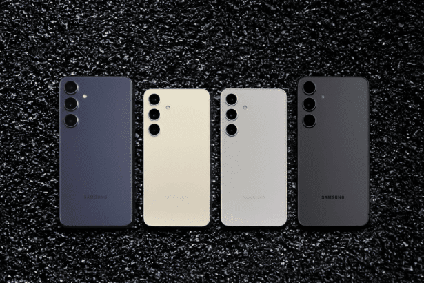 Four Samsung smartphones in different colors ( purple, cream, light grey, and black) laid out on a dark, textured background.