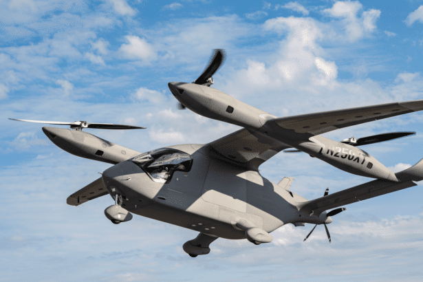 A gray futuristic VTOL aircraft with multiple propellers, flying against a partly cloudy blue sky. Filename : futuristic vtol aircraft.png