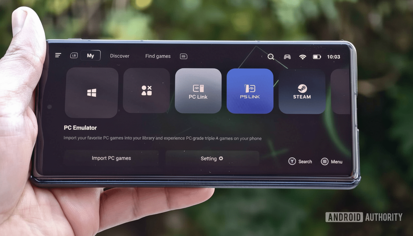 A hand holding a smartphone displaying a PC emulator interface with icons for Windows , PC Link, PS Link, and Steam, showcasing options to import PC games and settings .