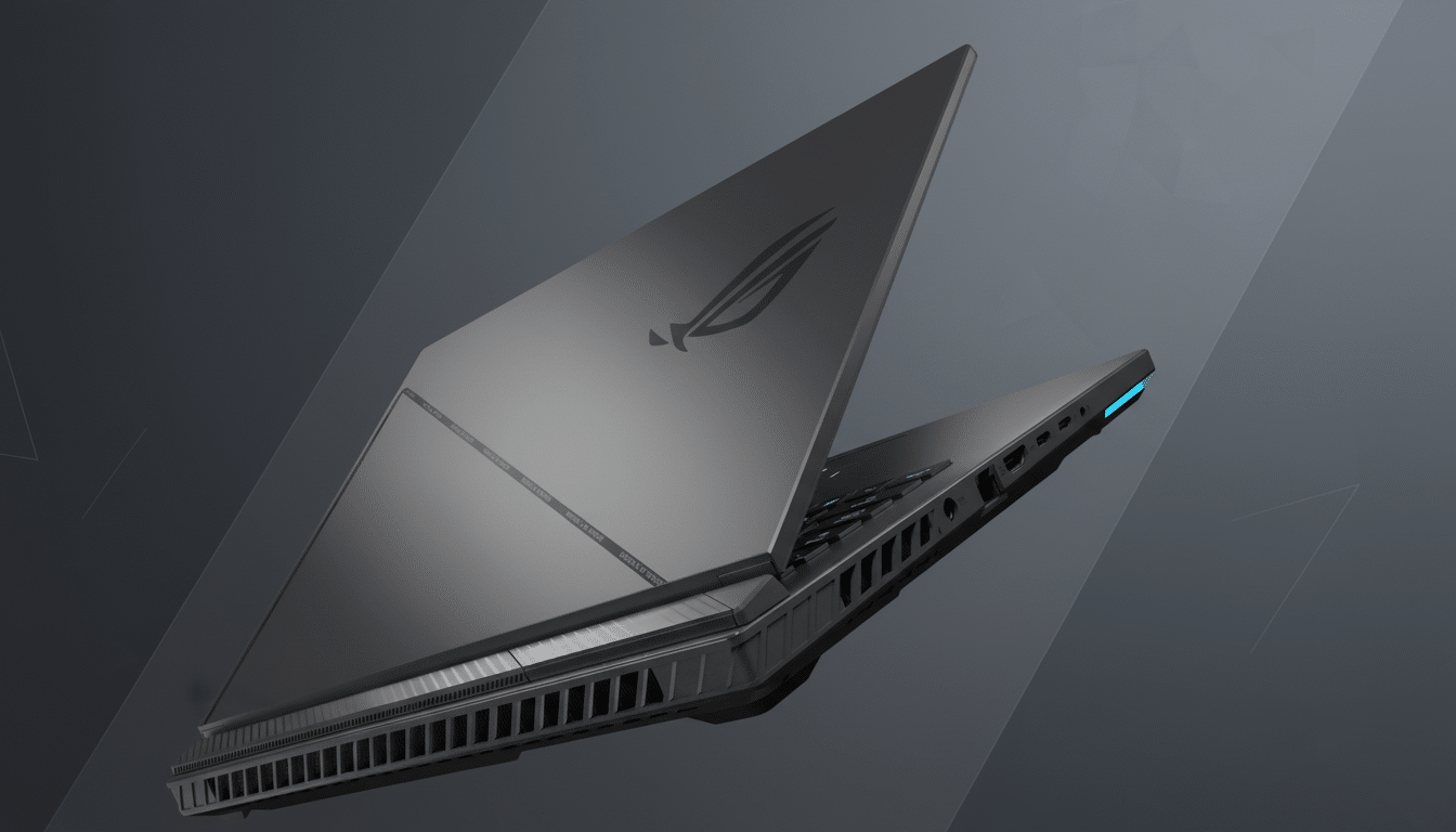 A professional shot of a dark gray gaming laptop with the lid slightly ajar, showcasing its sleek design and the Republic of Gamers logo. The backgrou