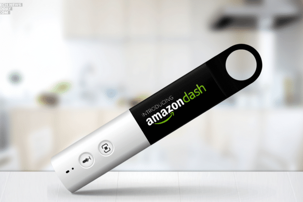 A 16: 9 aspect ratio image of the Amazon Dash button, a small white and black device, presented on a subtle white surface with a blurred background of