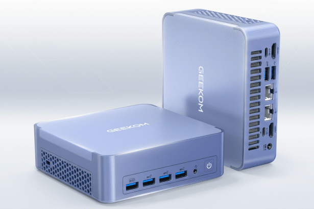 Two lavender - colored GEEKOM mini PCs are shown, one lying flat and the other standing upright behind it, showcasing their various ports and sleek design on a professional light background with subtle geometric patterns .