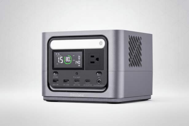 A professional shot of a gray G endome portable power station with various ports and a digital display. The background is a subtle , light gray gradient.