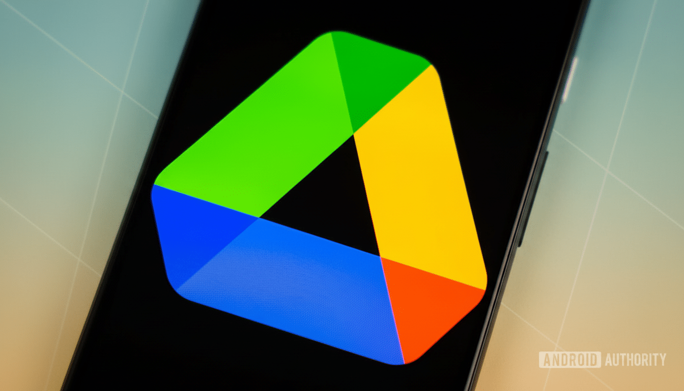 A professional close -up of the Google Drive logo displayed on a smartphone screen, with a subtle, soft gradient and geometric pattern background.