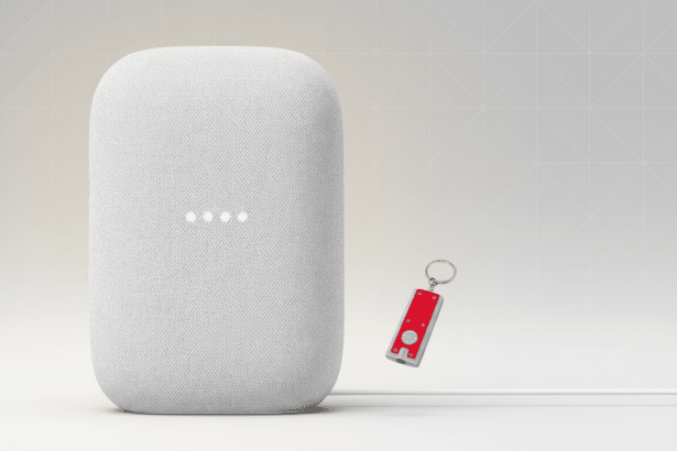 A white Google Nest speaker with a red keychain flashlight next to it, presented on a professional light gray background with subtle geometric patterns, resized to a 1 6:9 aspect ratio. Filename : googlenest speakerkey chainflashlight 16 9. png
