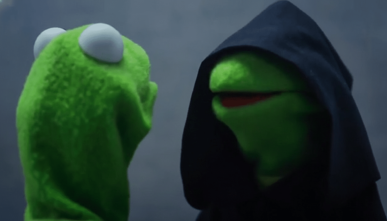 A 16:9 aspect ratio image of two Kermit the Frog puppets; one is light green , facing left , with a shocked expression, and the other is a dark green Evil Kermit wearing a black hooded robe, facing right with a sinister smile .