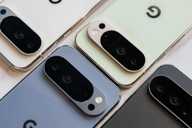 A close-up, high -angle shot of multiple Google Pixel phones in various colors, including white, light green, light blue, and dark gray. The Google lo